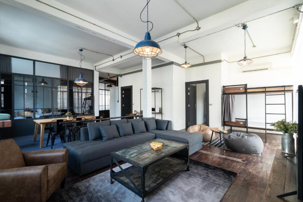 Spacious loft living room with sectional sofa and bunk beds