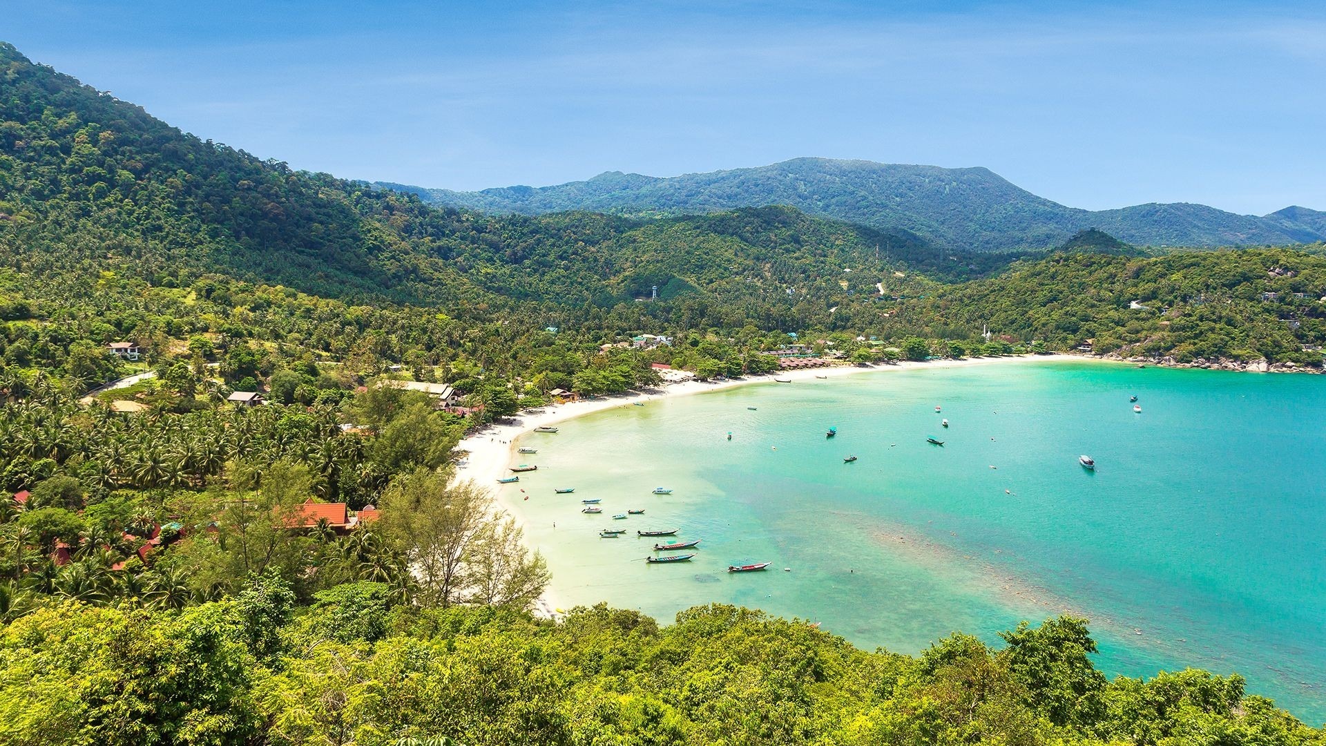 Thailand beach with turquoise waters and mountains